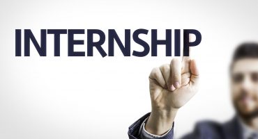 Business man pointing the text: Internship
